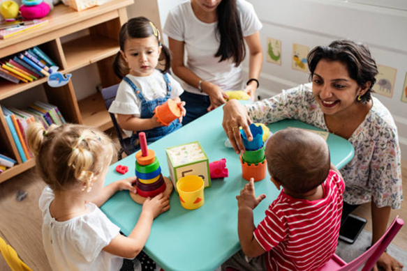 Picture of toddlers in child care classroom playing with toys
